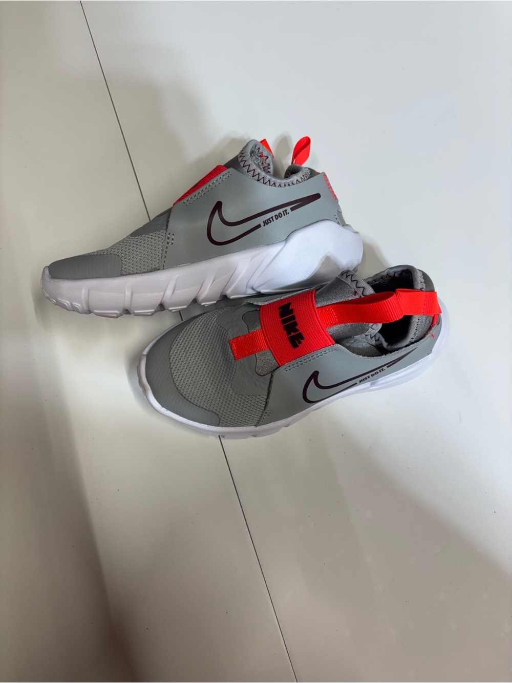 Nike Kids Gray Sneakers with Bright Red Accents